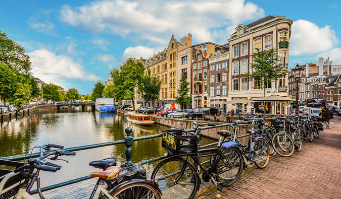 bicycles lining a bridge over the canal in Amsterdam