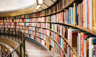 Curved row of bookshelves filled with books