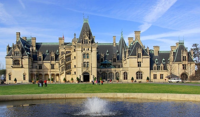 A massive old mansion surrounded by visitors in Asheville, North Carolina