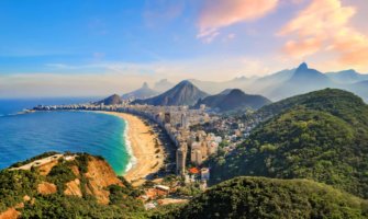 The stunning view overlooking the city of Rio in Brazil with lush, rolling mountains in the background