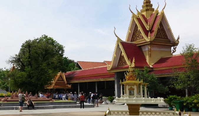 People visiting one of the many temples in Phnom Penh, Cambodia