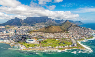 A view overlooking the city of Cape Town, South Africa on a bright and sunny day with mountains in the distance