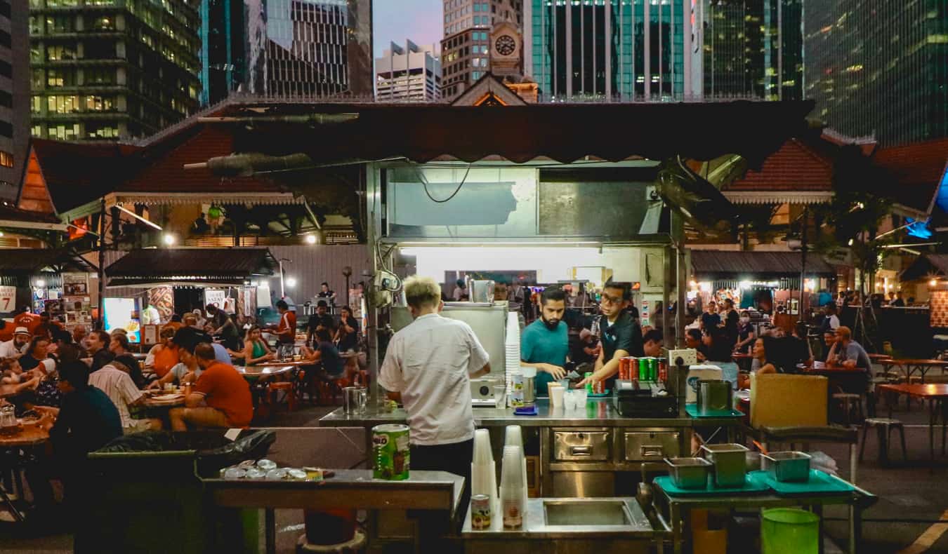 A food seller in Asia serving tasty local food