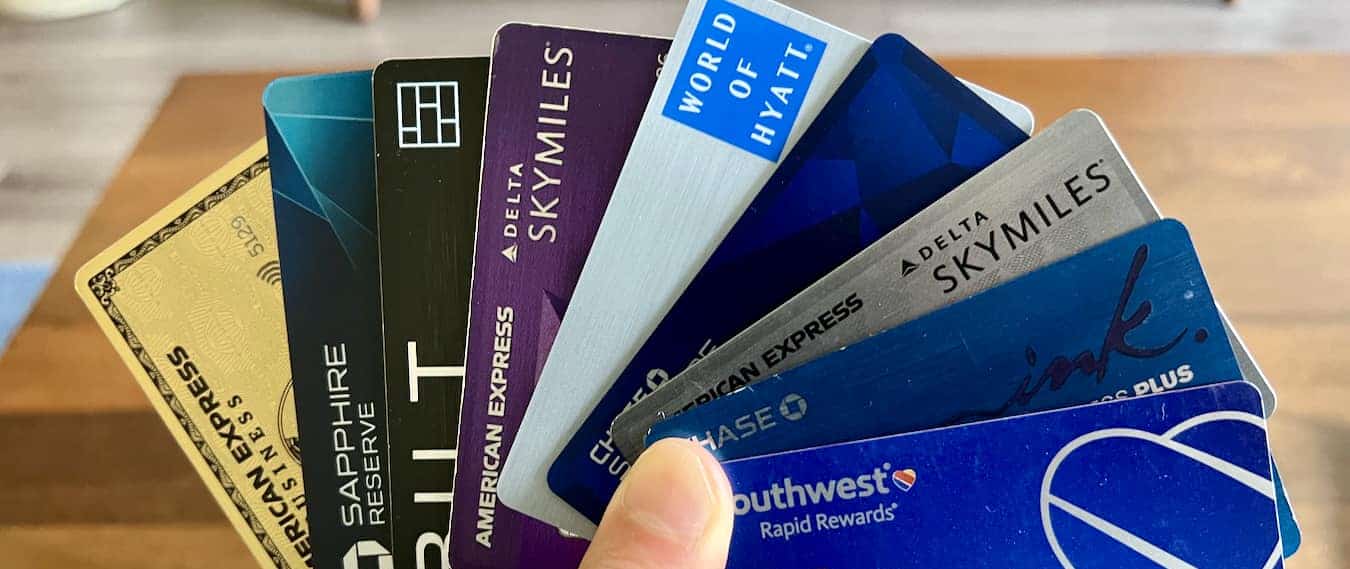 Nomadic Matt holding all of his favorite travel credit cards