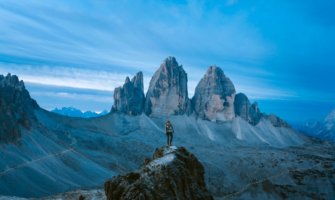 person on top of a mountain during dusk