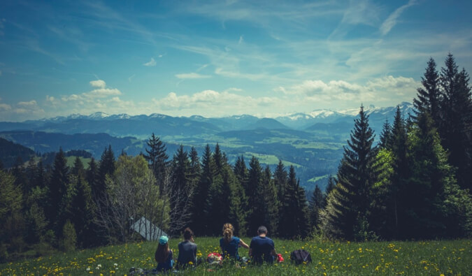 Photos of people overlooking mountains