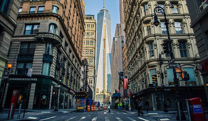 New York City street freedom tower is central in the background