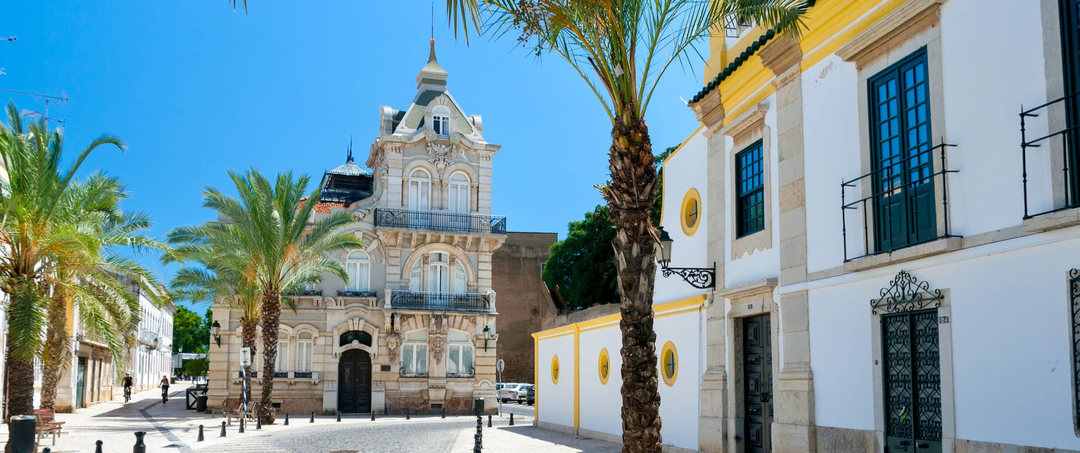 A quiet and narrow stone street in Faro, Portugal