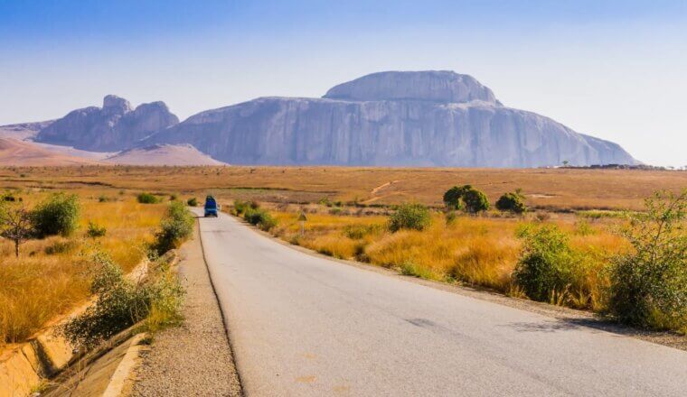 cenic view of Route Nationale 7 (RN7) in Madagascar, with Cardinal's hat, a huge granite mountain, in the background