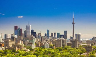 The towering skyline of Toronto, Canada on a bright and sunny summer day