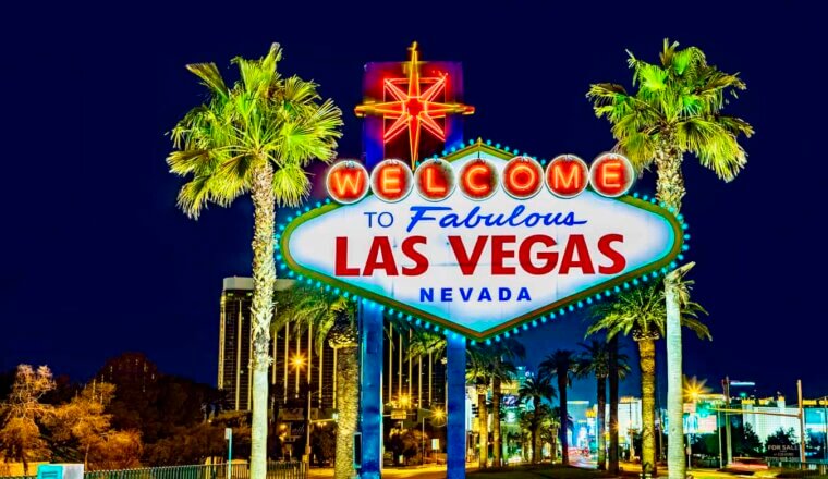 the iconic Vegas sign lit up at night in Las Vegas, USA