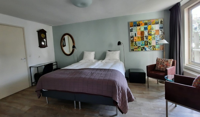 Simple guestroom with a double bed at Bed & Breakfast WestViolet in Amsterdam, the Netherlands